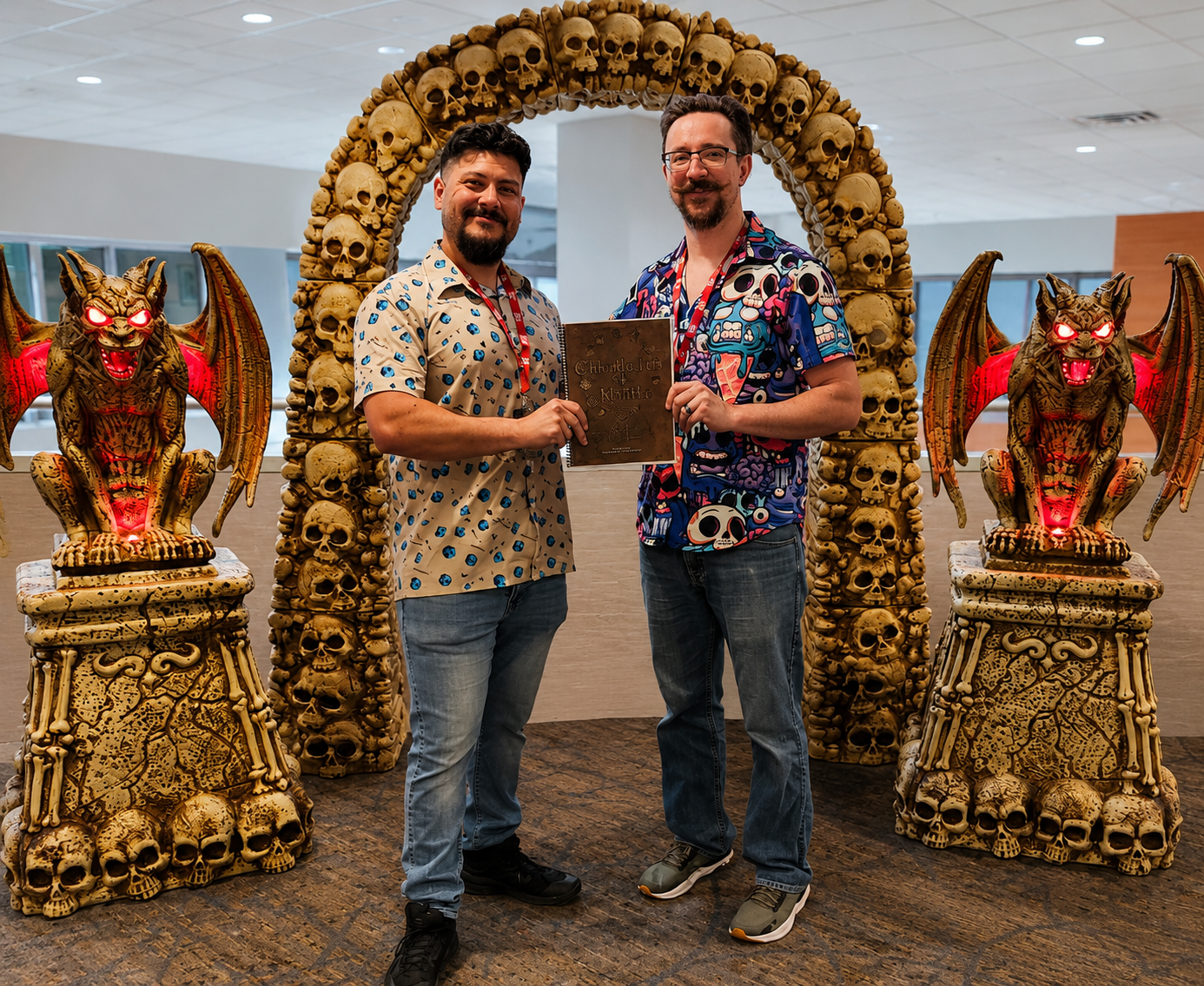 Jeremy and Wesley holding the first test print of the Chronicles of Myth: Skirmish ruleset at a gaming convention